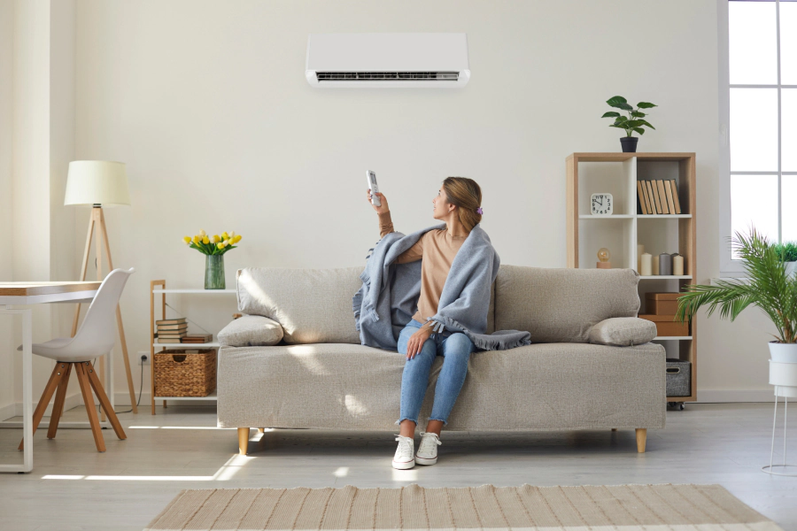 woman on living room opening ac unit